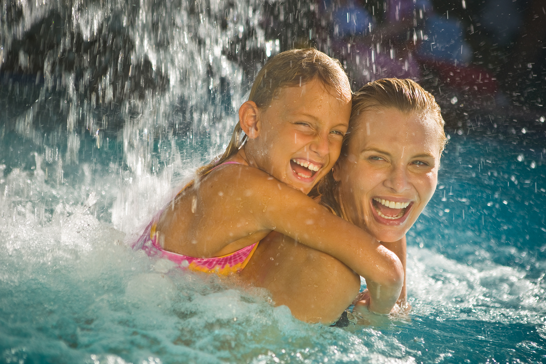 Pool time for a mom and her kid at the resort.